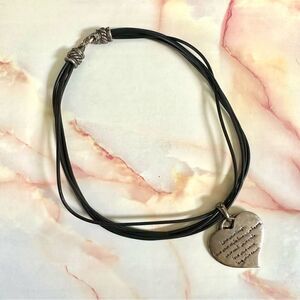 Silver tone double heart pendant necklace on black cord